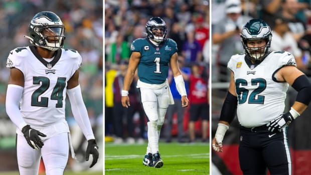 James Bradberry walks; Jalen hurts stands on the field; Jason Kelce looks to the side with a hand on his hip